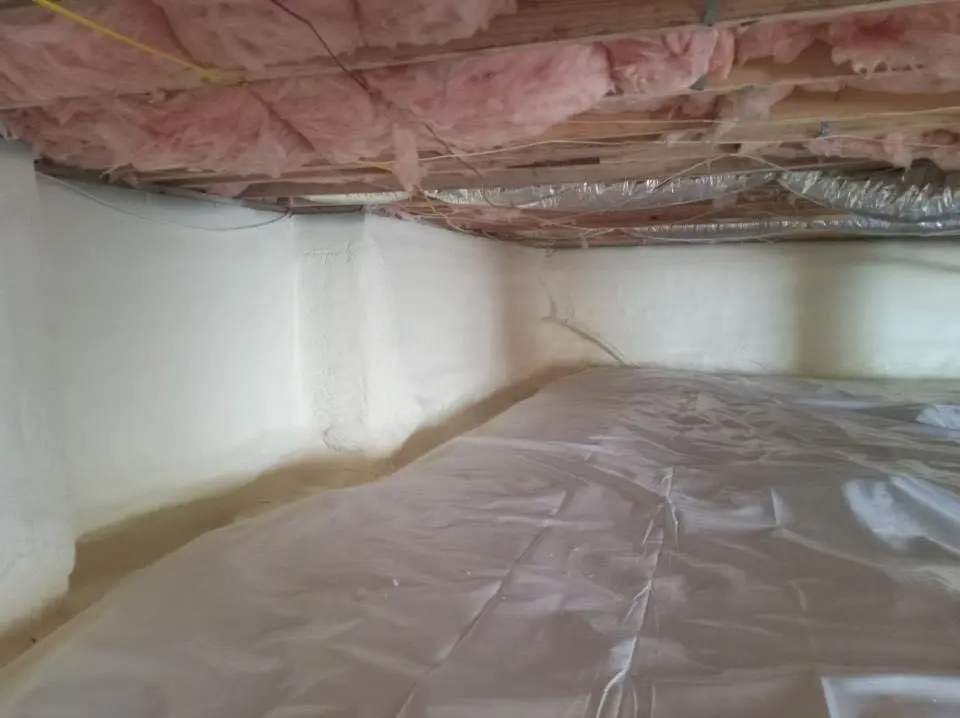 Crawl space encapsulation with closed-cell spray foam for Commercial Roof Restoration in Moores Mill